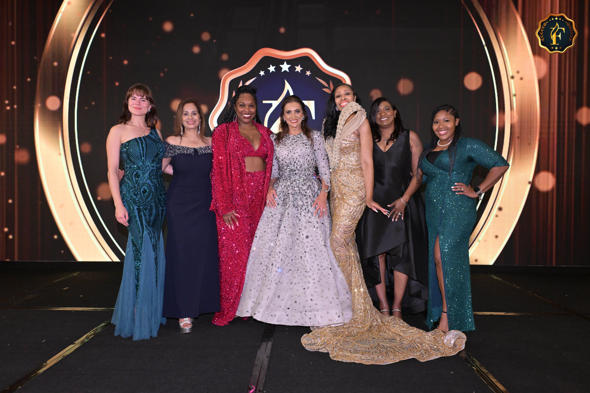 Janine Jakob with fellow attendees on stage at the Fluxx Awards