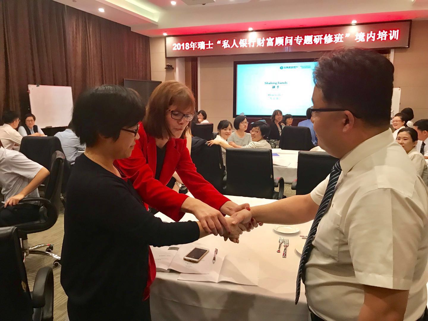 Janine Jakob facilitating an interactive professional training exercise in China